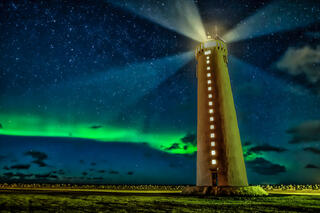 Milky way next to a lighthouse